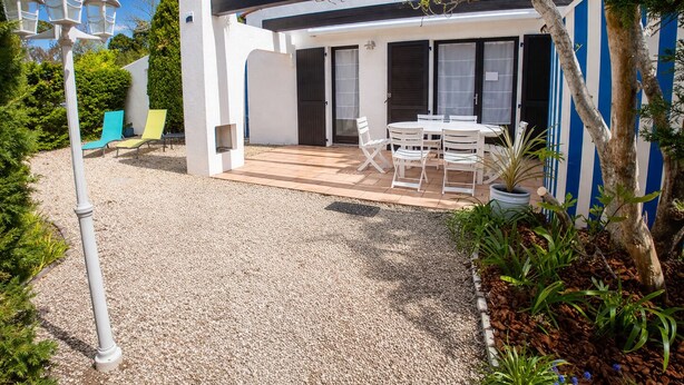 A modern house with a patio, outdoor seating, and a garden. - Vacation home 250 m from the beach and forest. (Saint-Jean-de-Monts)