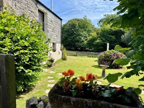 A stone building with a garden in front. - The Mill, Lostwithiel (Lostwithiel)