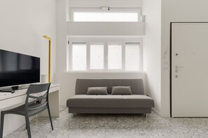 Living area - GuestHost - Cozy flat of approximately 60sqm, ideal for 3, located on the ground floor of a building.The accommodation is located in the Greco area, characterized by a historic atmosphere, with the Church of San Martino and the Naviglio della Martesana a (Milan)