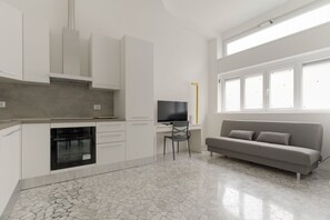 Living area - GuestHost - Cozy flat of approximately 60sqm, ideal for 3, located on the ground floor of a building.The accommodation is located in the Greco area, characterized by a historic atmosphere, with the Church of San Martino and the Naviglio della Martesana a (Milan)