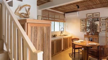 Deluxe Suite | Living area | 55-inch flat-screen TV with digital channels, Netflix, smart speakers