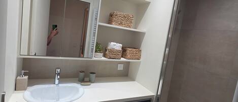 Shower, towels, soap, toilet paper
