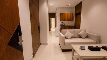 Departamento, 1 habitación | Área de sala de estar