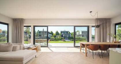 Brand new 8-person accessible villa on the water with hot tub, sauna, and swing