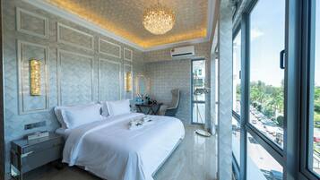 Deluxe Room, 1 King Bed, City View | In-room safe, desk, laptop workspace, blackout drapes