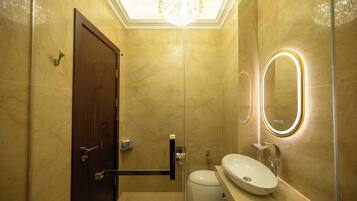 Deluxe Room, 1 King Bed, City View | Bathroom | Separate tub and shower, free toiletries, hair dryer, slippers