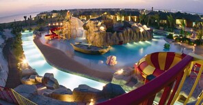 A water park with a hot air balloon ride, a slide, and a pool area. - Sunset Beach Resort For Entertainment (Al Khobar)