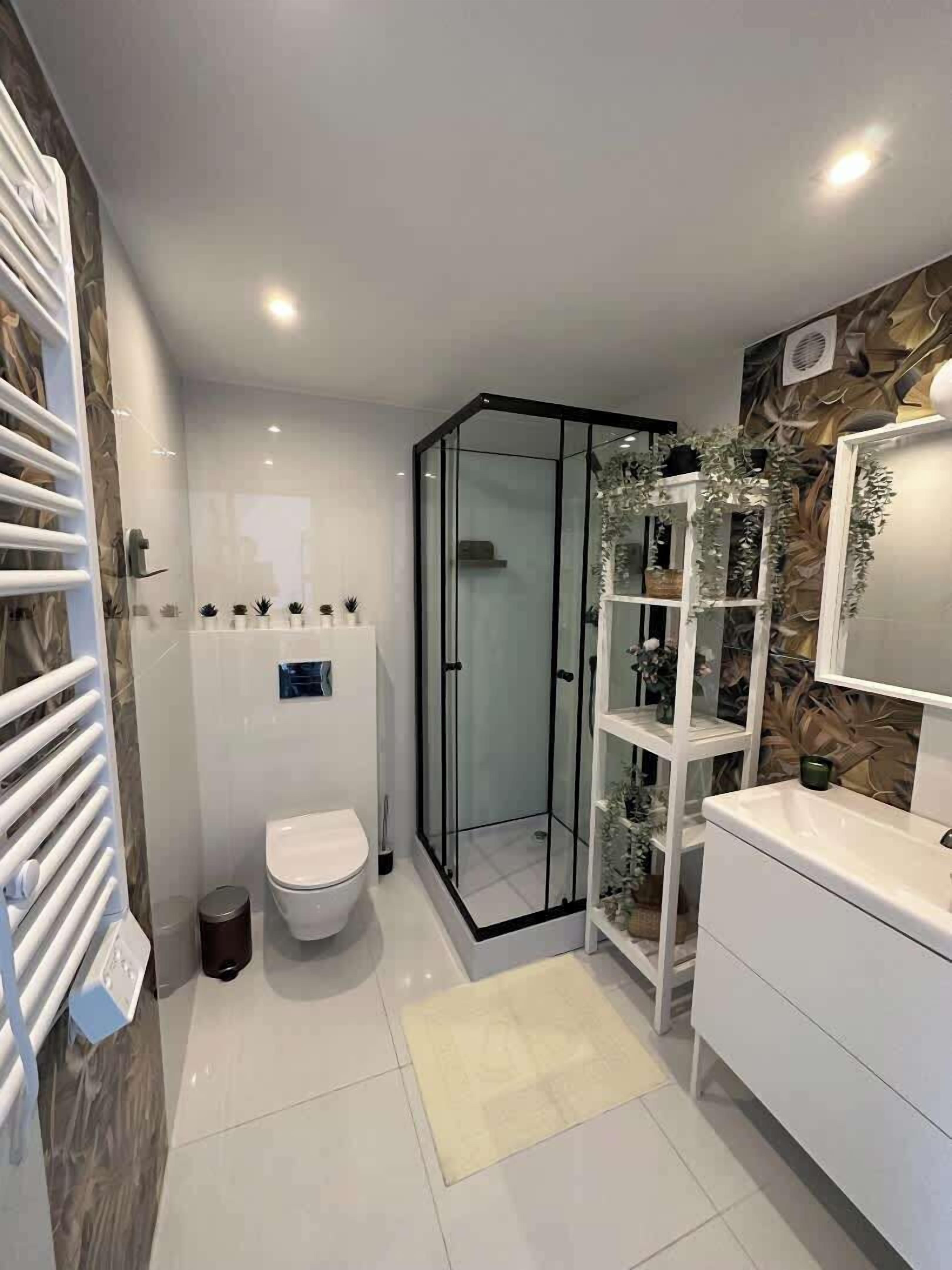 Shower, towels, soap, toilet paper
