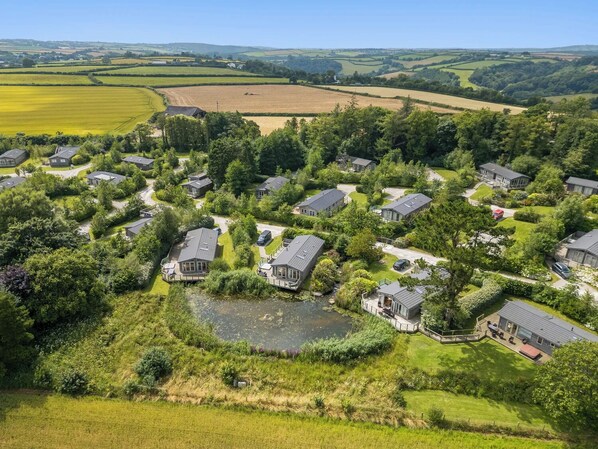 A residential area with houses surrounded by greenery and fields. - 3 Faraway Fields (Liskeard)