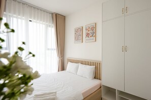 Desk, laptop workspace, blackout curtains, soundproofing - Magnolia Vinhomes Apartment (Long Binh)