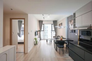 Desk, laptop workspace, blackout curtains, soundproofing - Magnolia Vinhomes Apartment (Long Binh)