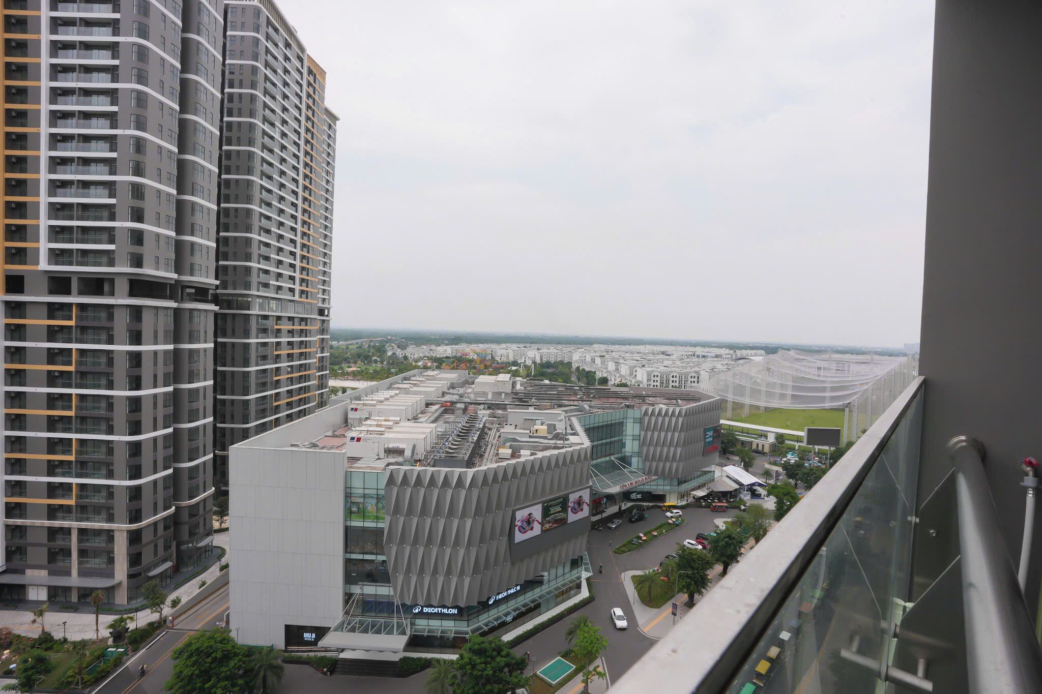 A high-rise building with a modern architectural design, featuring a curved facade and multiple balconies.