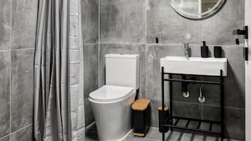 Standard Apartment, Garden View | Bathroom | Shower, hair dryer, slippers, towels