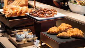 A buffet with various food items, including pastries and fruits. - IntercityHotel Shenzhen Bay (Shenzhen)