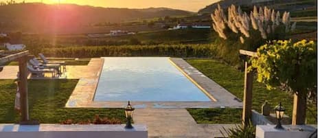 Outdoor pool, open 9:00 AM to 9:00 PM, sun loungers