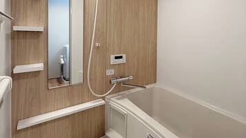 Family Apartment | Bathroom | Separate tub and shower, hair dryer, slippers, towels