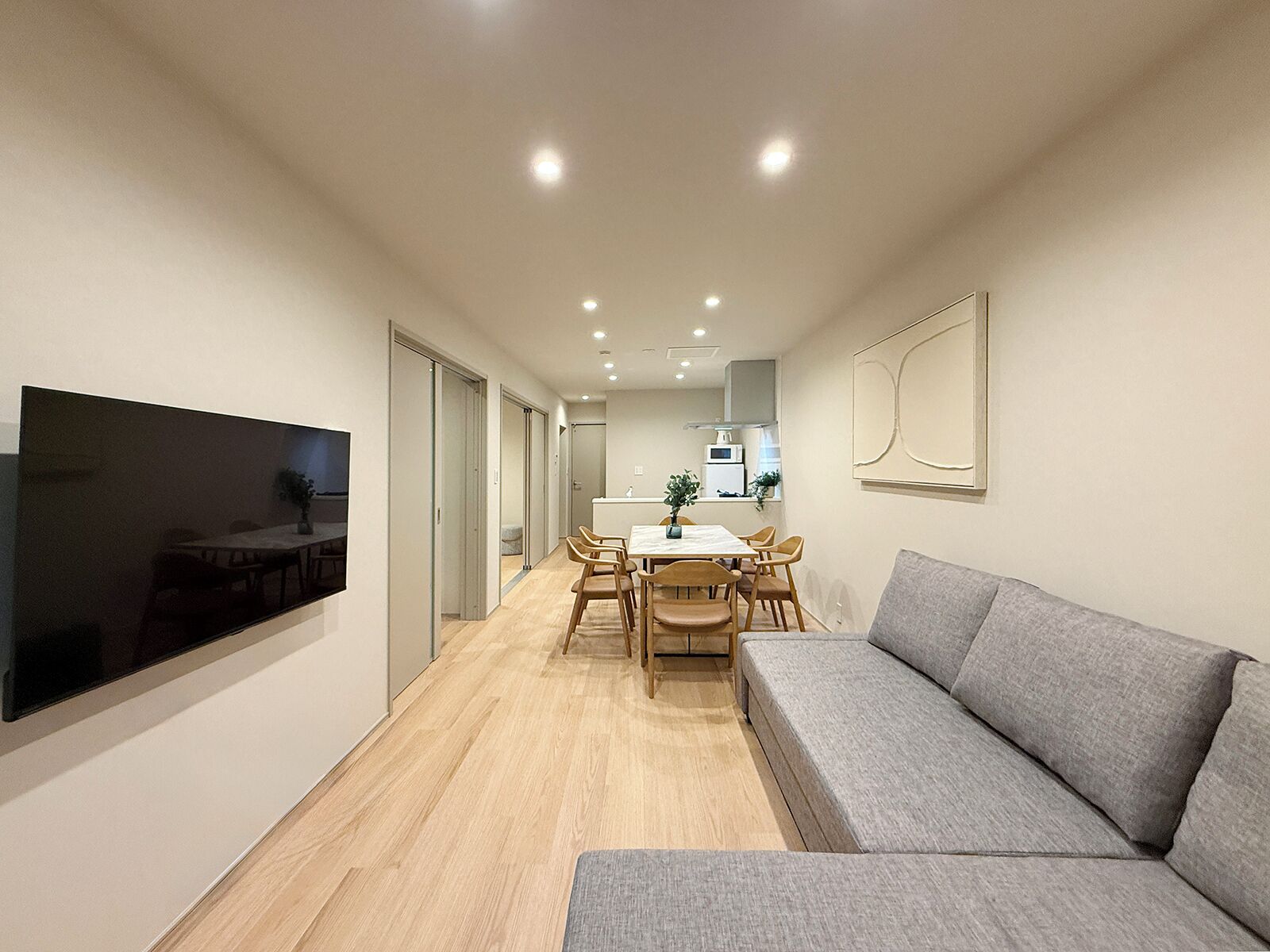 Comfort Apartment | Living area | 55-inch Smart TV with cable channels