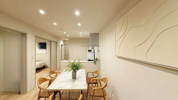 Family Apartment | Living area | 55-inch Smart TV with cable channels