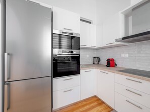 Departamento Deluxe, vista a la ciudad | Cocina privada