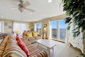 Living area - LISTEN TO THE SONG of the surf from this adorable island home. (St. George Island)