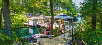 Lakefront home with granite counters, fireplace, lake views, & dock