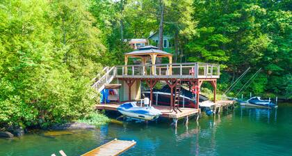 Lakefront home with granite counters, fireplace, lake views, & dock