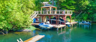 Lakefront home with granite counters, fireplace, lake views, & dock