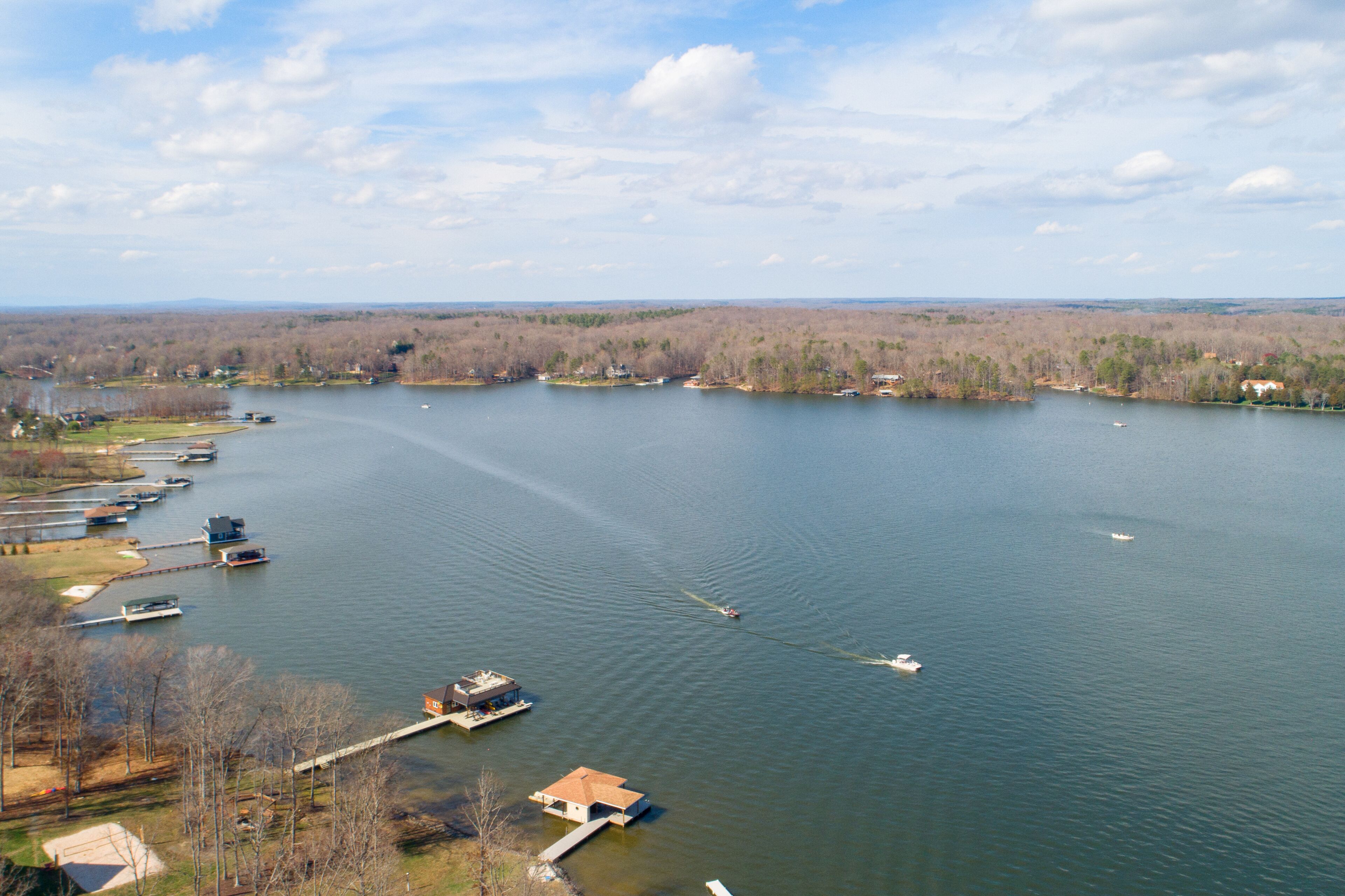 A large lake with several docks and boats.