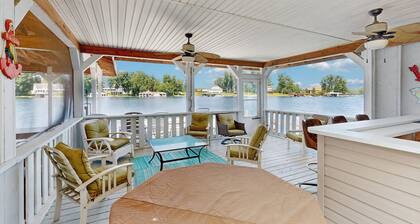 Relaxing lakeside retreat with boathouse, dock, deck, firepit and screened porch