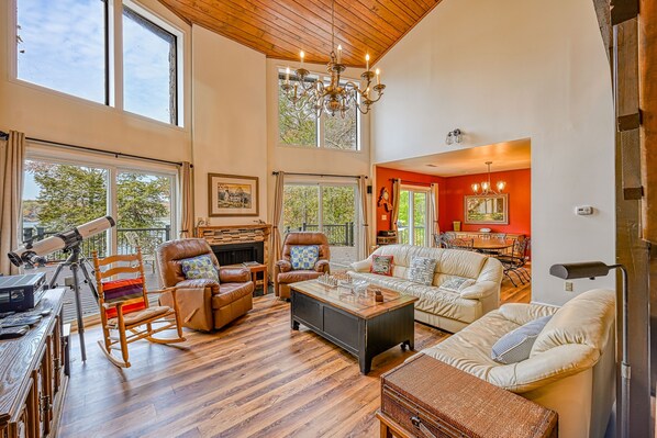 Living area - Enchanting lakefront oasis with fire pit, generous patio, dock, & amazing views (Mineral)