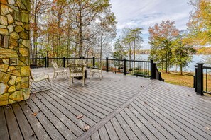 Outdoor dining - Enchanting lakefront oasis with fire pit, generous patio, dock, & amazing views (Mineral)