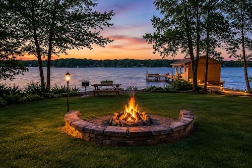 Enchanting lakefront oasis with fire pit, generous patio, dock, & amazing views