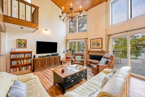 Living area - Enchanting lakefront oasis with fire pit, generous patio, dock, & amazing views (Mineral)
