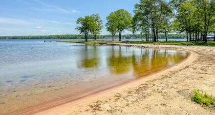 Three-story lakefront home w/ covered boat slip, and tennis/pickleball access