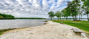 Lakefront home with kayaks, private patio, air hockey, grill, & balcony