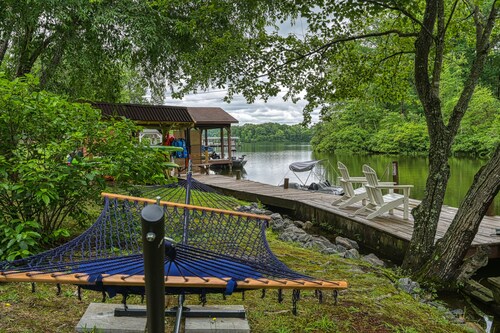 Dog-Friendly lakefront home with dock, game room, kayaks, hot tub, & firepit