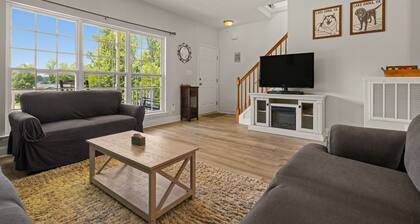 Lakeview escape near beach with fenced dog run, porch & dock with one boat slip