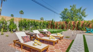 A patio with lounge chairs, a small pool, and a well-maintained garden. - Yard Games, Outdoor Kitchen: Palm Springs Retreat! (Palm Springs)