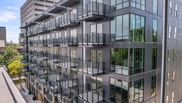 A multi-story building with balconies and large windows. - Lone Tree Pass | King + Queen | Balcony + Parking (Knoxville)