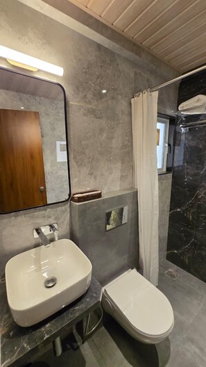 Deluxe Double Room | Bathroom sink - P K Unicorn Hotel & Banquet (Panvel)