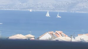 A coastal view with houses and sailboats on the water. - Gavriil Apartments Corfu - Seaview Studio Retreat (Kavos)