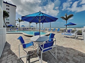 Outdoor dining - Pointe South 306 | Modern Gulf Escape + Pool (Fort Myers Beach)
