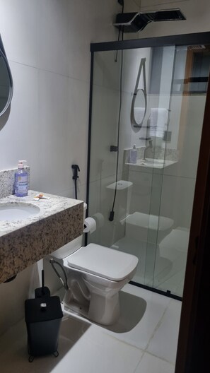 Shower, towels, soap, toilet paper