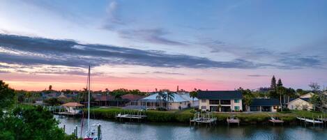 A waterfront property with houses, docks, and a marina.