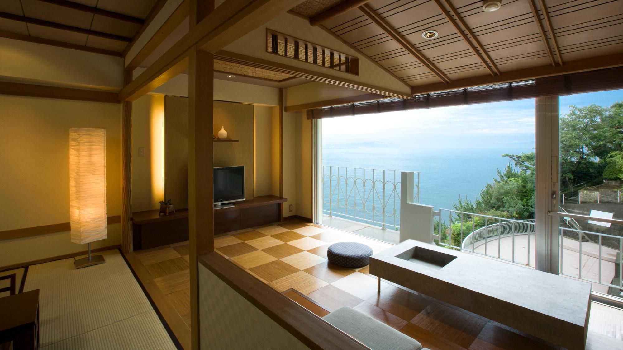 A modern room with a checkered floor, a television, a sofa, and a view of the sea.