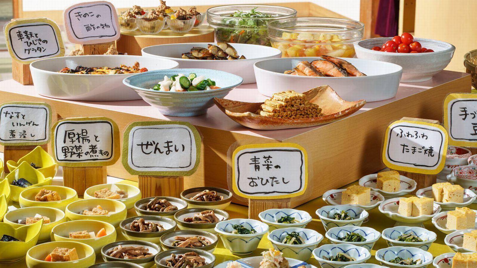 A variety of food dishes with labels in a restaurant setting.