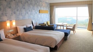 A hotel room with two beds, a small table, a chair, and a balcony with a view. - Hotel Harvest Katsuura (Katsuura)