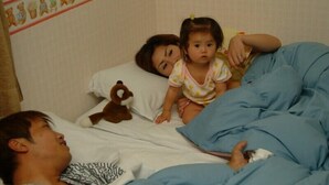 A bed with blue bedding, a pillow, and a teddy bear. - Kids Pension Fruit Juice Awajishima (Awaji)