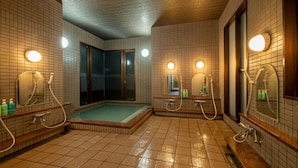 A wet bathroom with tiled floors, a shower area, and multiple mirrors. - Taiheian (Sakai)