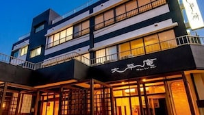 A multi-story building with a modern design, featuring balconies and large windows. - Taiheian (Sakai)